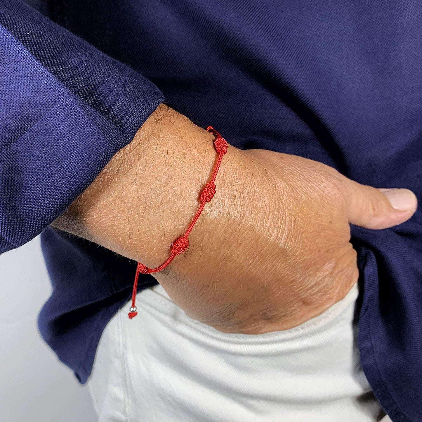 Pulsera Roja con 7 Nudos con Mini Ojo Turco de Plata